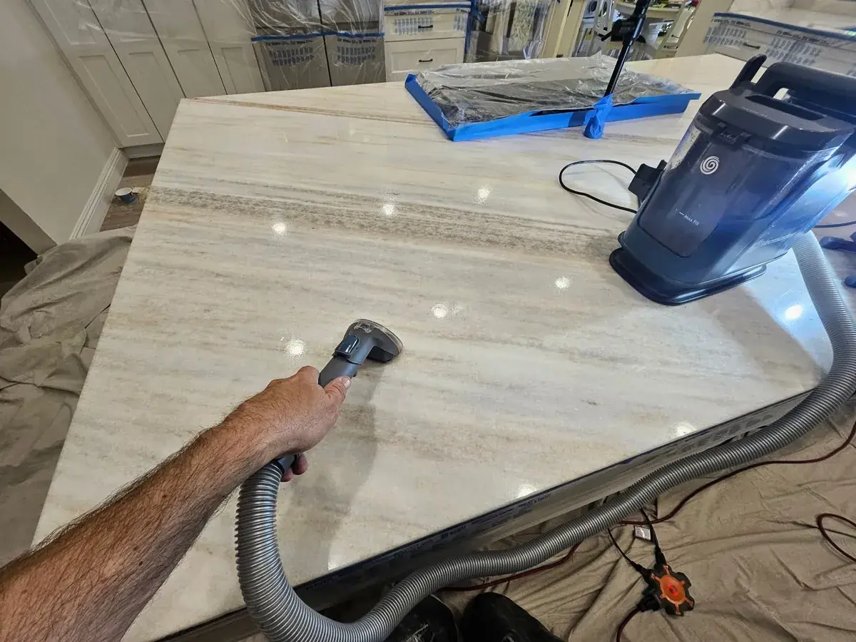 Marble floor mid-polish with a restored sheen